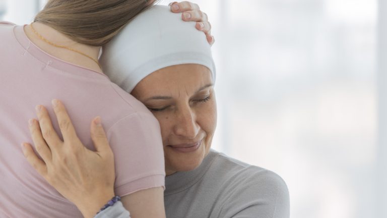 terminally ill patient embracing a family member